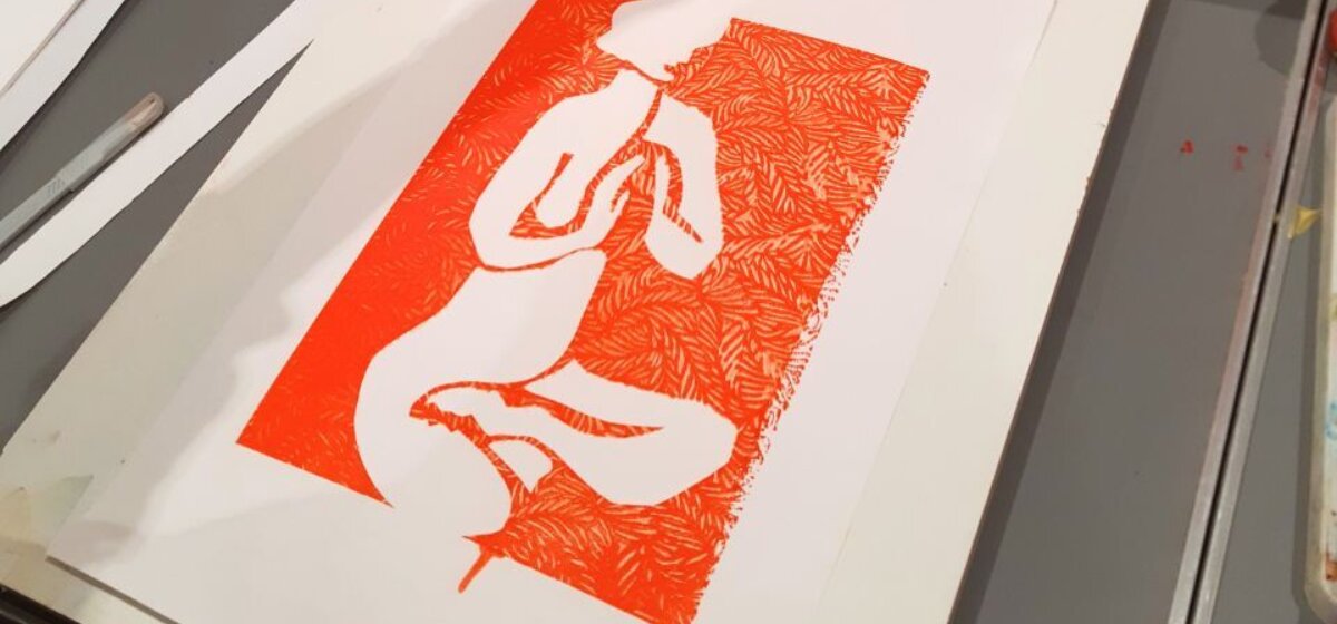 An image for Screen Printing Portraits at The Base, pictured is an orange stenciled screenprint of a woman's body