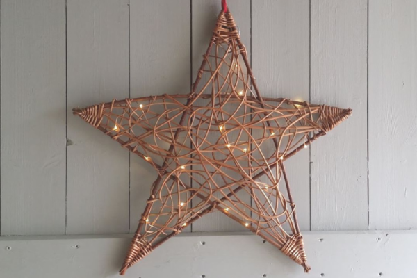A star made out of willow with fairy lights