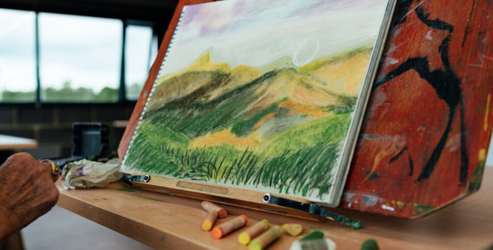 Watercolour and pastels artwork of a landscape on canvas at The Base.