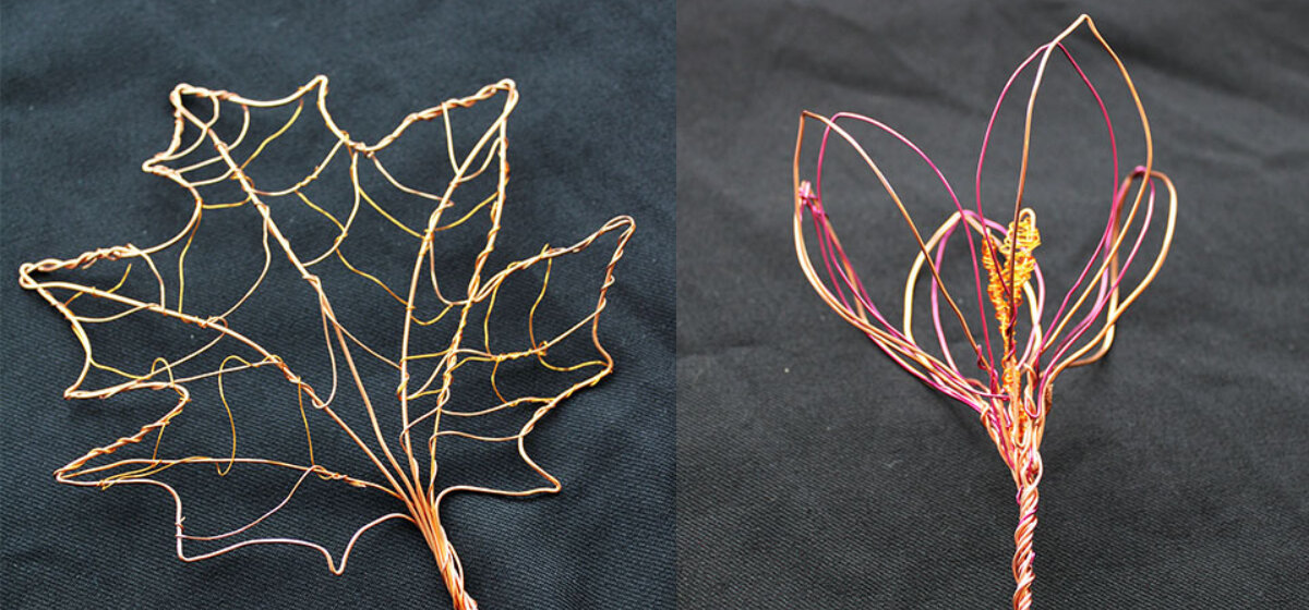 Wire sculptures of a leaf and a crocus landscape.
