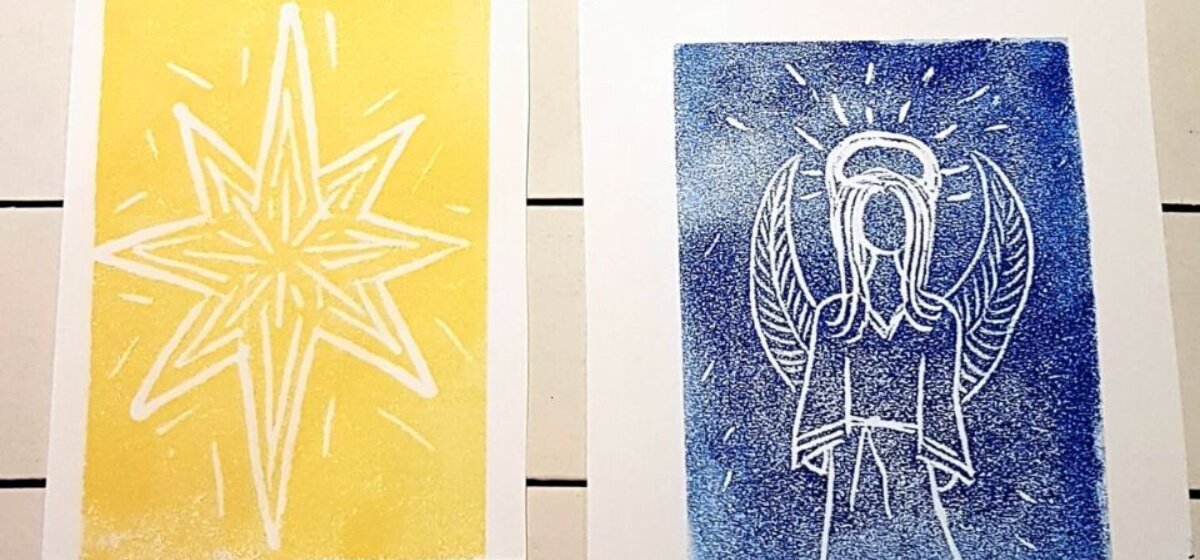 Image of two different print Christmas cards one of a yellow star and one of an angel with a blue background