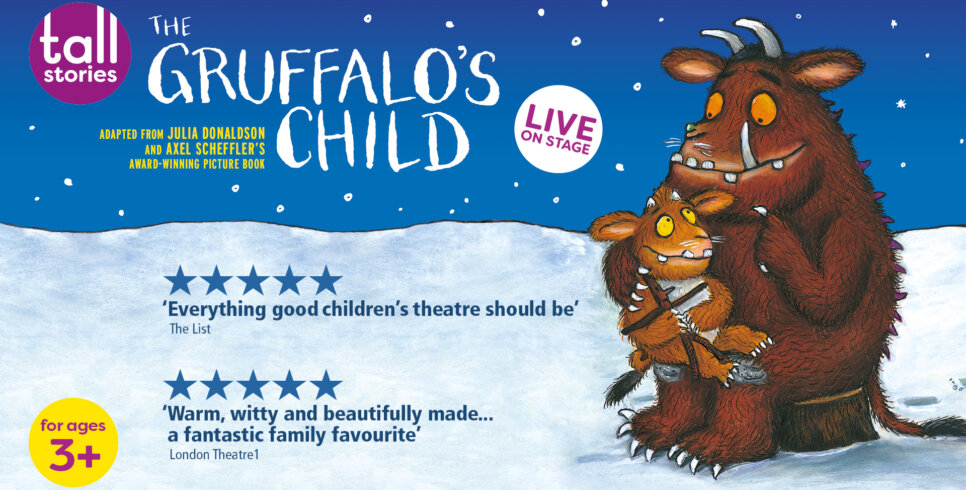 The Gruffalo and their child sat together on a snowy landscape