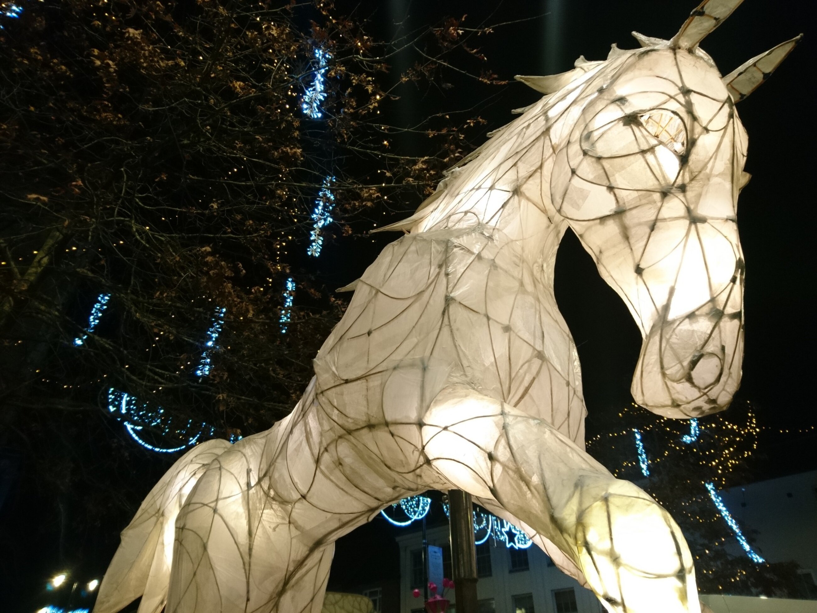 A giant leaping horse made of withies and paper